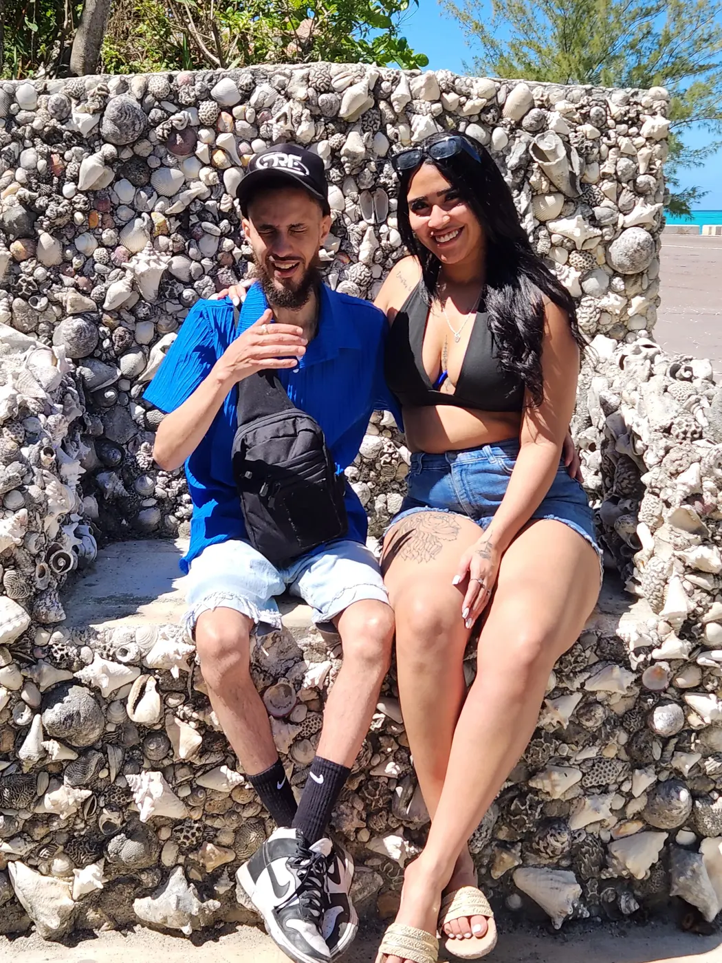 A couple on the stone throne seat