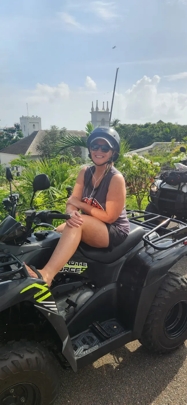 Riding an ATV under the palms