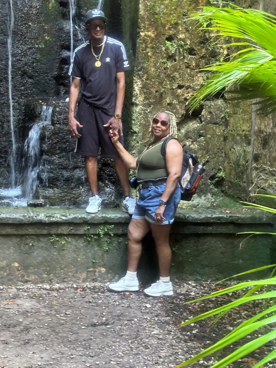 Two guests at the cave waterfall