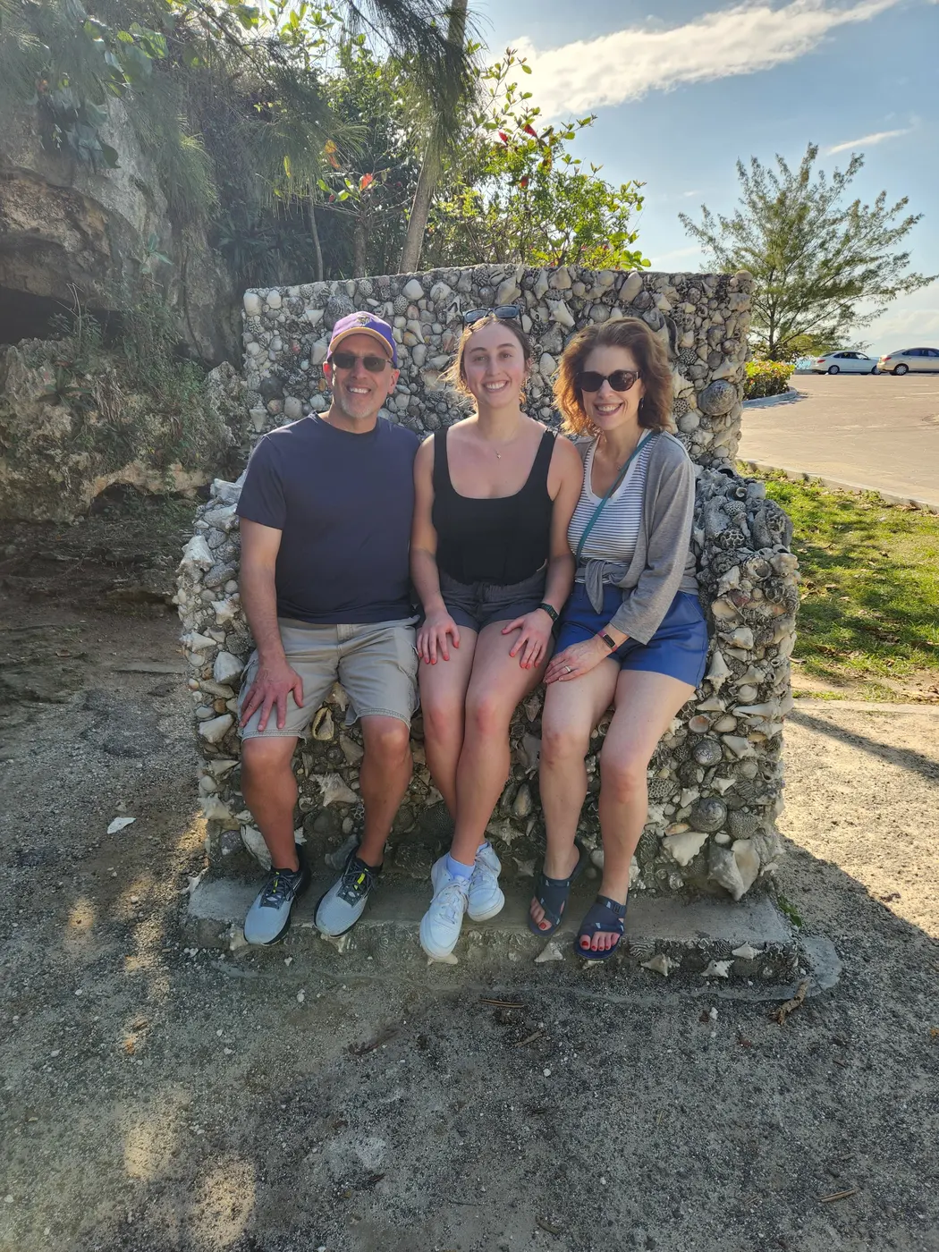 Three guests on the stone throne seat