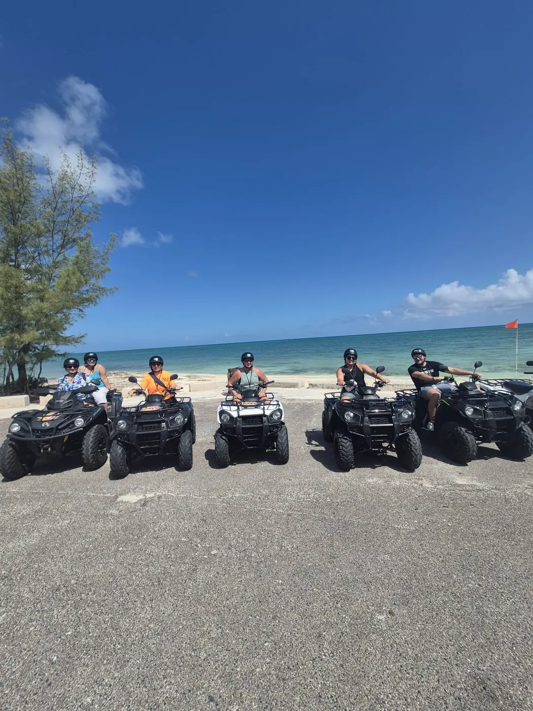 A row of ATVs on the beach road