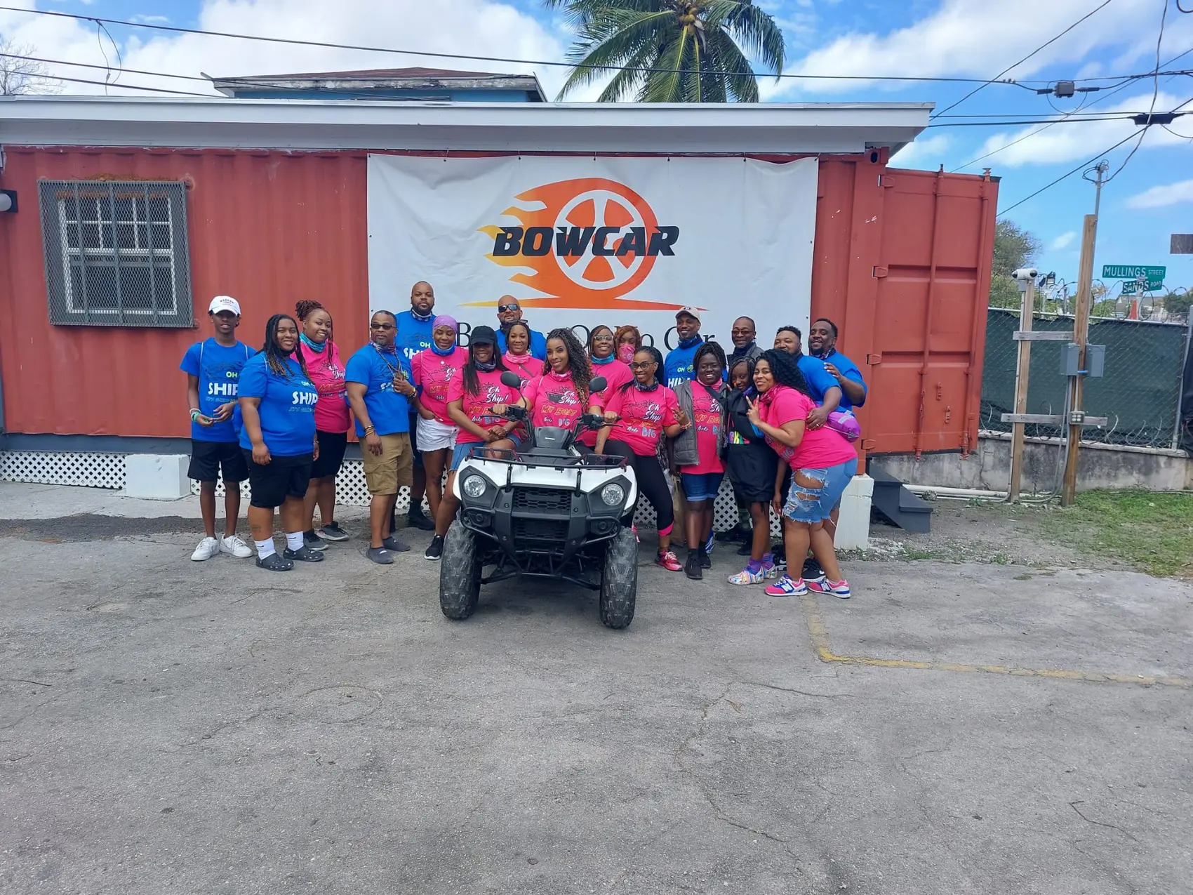 A tour group in front of the Bowcar building in Nassau