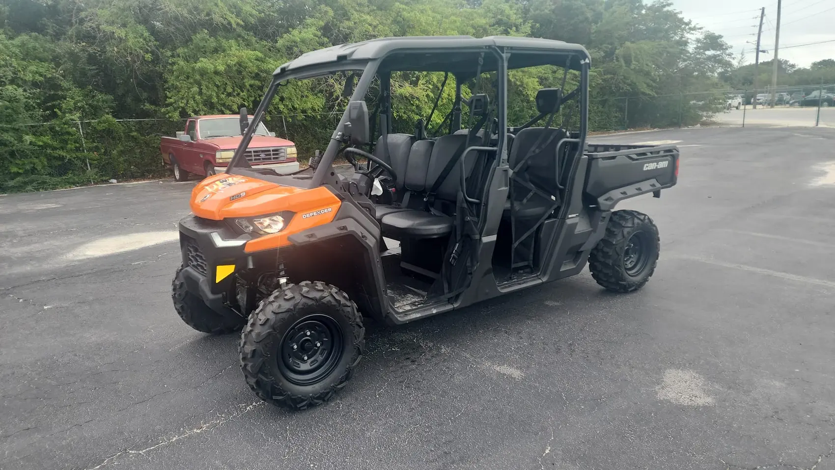 Side view of an orange Can-Am buggy