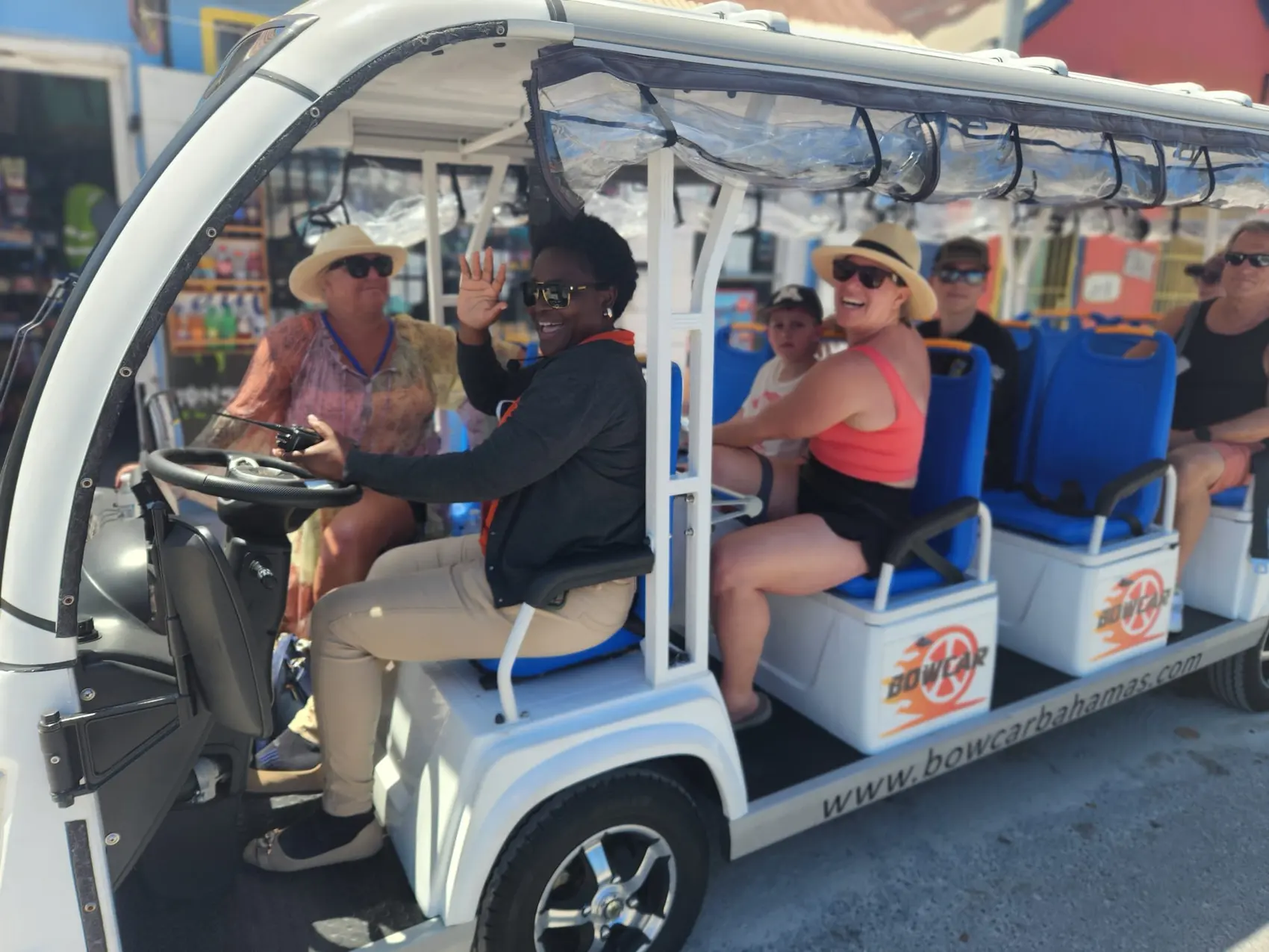Guests riding the Bowcar open-air shuttle