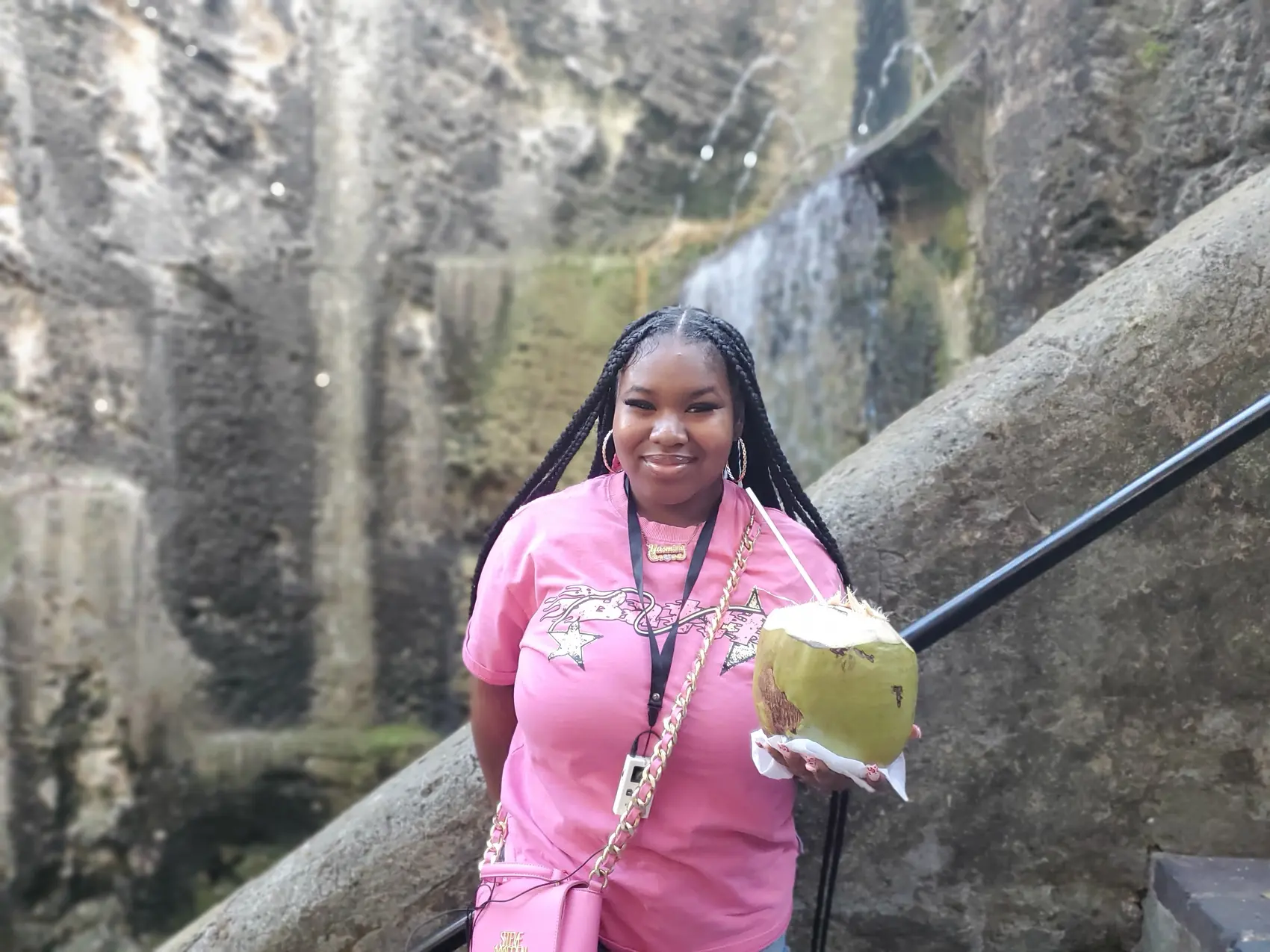 A guest with a fresh coconut at the Island Caves