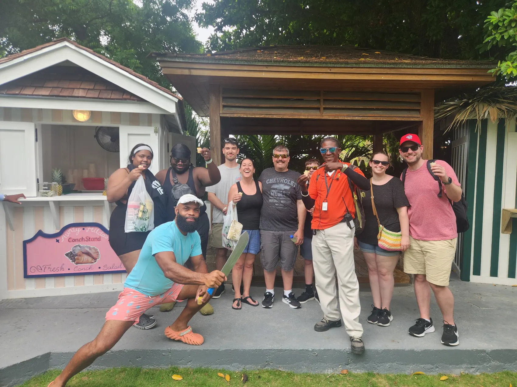 A private tour group posing with their Bowcar guide in Nassau